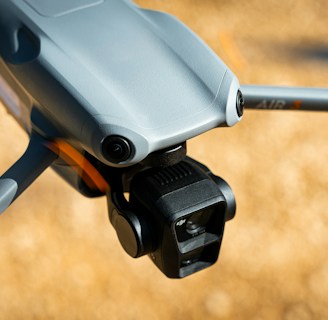 Close-up of a drone equipped with spraying technology.