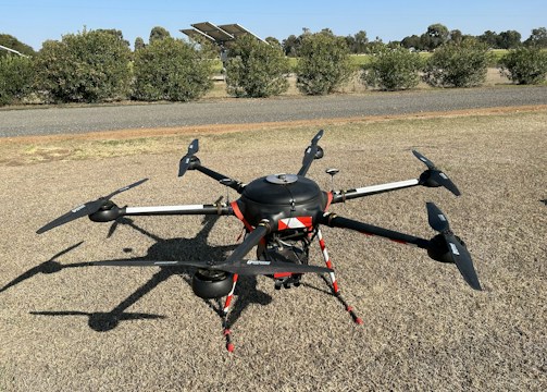 A drone monitoring a large industrial site.