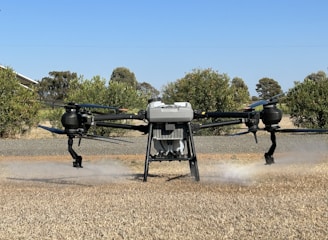 A close-up of a drone spraying crops.