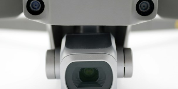 A close-up of a drone equipped with sensors and cameras ready for inspection.